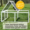 An outdoor rabbit run with a white frame and black wire mesh, set on a grassy lawn with trees in the background. Produktbild-Vorschau