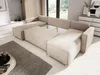 A large, U-shaped sectional sofa in a living room setting, with a rug and a coffee table in the foreground. Náhled obrázku produktu