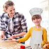 A mother and daughter are baking cookies together. Produktbild-Vorschau