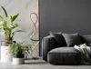 A modern living room scene featuring a floor lamp, sofa, and plants. Produktbild-Vorschau