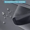 Close-up of dark gray waterproof fabric with water droplets on it, and a text overlay indicating it is waterproof. Produktbild-Vorschau