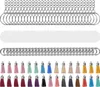 A collection of DIY keychain supplies, including acrylic blanks, jump rings, and colorful tassels, arranged in neat rows. Produktbild-Vorschau
