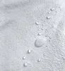 A close-up view of water droplets on a textured white surface, likely fabric. Náhľad obrázku produktu