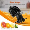 A close-up of two black juicer cones with orange juice splashing in the background, and cut citrus fruits in the foreground. Produktbild-Vorschau