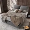 A bedroom scene with a bed, pillows, and blankets. Náhled obrázku produktu