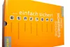 A close-up of an orange product box with text and icons describing safety features. Produktbild-Vorschau