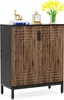 A cabinet with decorative doors and a black frame, placed on a white background. Decorative items are placed on top of the cabinet. Voir les images du produit