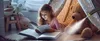 A young girl reading a book in a tent with stuffed animals. Steam is being applied to a teddy bear. Náhled obrázku produktu