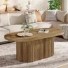 A living room scene featuring a sectional sofa, a coffee table, and decorative items. Voir les images du produit