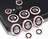 A collection of camera lens protectors with decorative rhinestones arranged on a dark surface. Produktbild-Vorschau