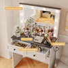 A vanity table with makeup and accessories, featuring LED lights and drawers. Voir les images du produit
