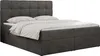 A dark gray upholstered boxspring bed with a tufted headboard and white bedding, shown against a white background. Produktbild-Vorschau