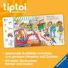 An open children's book showing a busy street scene with an excavator, people, and various objects to find. The book is open to a page with illustrations and text. Voir les images du produit
