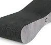 A close-up view of a black and gray cat scratching post. Voir les images du produit