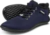 A pair of navy blue ankle boots with black laces and a black sole. Produktbild-Vorschau