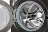 Close-up view of the inside of a washing machine drum with the door open. Produktbild-Vorschau