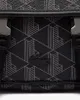 A close-up view of a black bag with a geometric pattern and a Lacoste logo. Anteprima dell’immagine prodotto