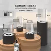 Several bioethanol table fireplaces of different sizes are displayed on wooden stands, with text overlays indicating features and dimensions. Produktbild-Vorschau