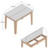 Diagrams showing the dimensions and extension mechanism of a table. Anteprima dell’immagine prodotto