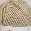 A close-up view of a ball of beige yarn. Produktbild-Vorschau