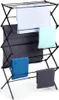 A black collapsible drying rack with several towels draped over it. Produktbild-Vorschau
