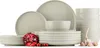 A collection of beige ceramic dishes, including plates and bowls, arranged on a white background with a pomegranate and garlic bulbs. Náhľad obrázku produktu