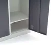 Interior view of a metal cabinet with two shelves and one open door. Produktbild-Vorschau