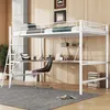 A loft bed with a desk and shelves underneath, set up in a room with wooden walls and a concrete pillar.