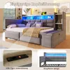 A modern bedroom setting with a daybed featuring integrated storage, LED lighting, and charging ports. Podgląd zdjęcia produktu
