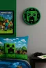 A bedroom scene with Minecraft-themed decor, including a wall clock and pillow. Produktbild-Vorschau