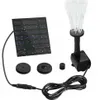 A solar-powered fountain pump with multiple sprinkler heads and a solar panel. Voir les images du produit