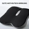 A close-up shot of a black and gray seat cushion with a textured surface, set against a white background. Produktbild-Vorschau