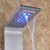 A close-up view of a modern LED shower panel with water flowing and blue lights. Náhľad obrázku produktu