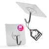 Two adhesive hooks are shown against a white background. One hook is attached to a square backing, and the other is suspended from a string with a tag. Produktbild-Vorschau