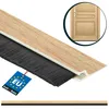 A close-up view of a door seal strip with a wood-like finish and black bristles, with a small inset image of a wooden door. Produktbild-Vorschau