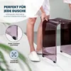 A person in a robe and slippers is standing next to a transparent mauve acrylic shower stool in a bathroom. Anteprima dell’immagine prodotto