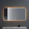 A modern bathroom mirror with integrated LED lighting, mounted on a gray wall above a vanity. Anteprima dell’immagine prodotto