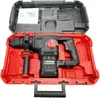 A cordless hammer drill is displayed inside its red and black carrying case, with a manual on top. Produktbild-Vorschau