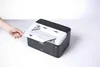 A hand is inserting a document into a Brother laser printer. Náhľad obrázku produktu