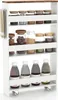 A white rolling storage cart with four shelves filled with various food items in jars and bottles. Podgląd zdjęcia produktu
