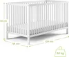 A white baby crib with dimensions indicated by green lines and text. Produktbild-Vorschau