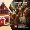 A grandfather and child decorating a Christmas tree with a star. Produktbild-Vorschau