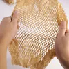 Two hands holding and stretching honeycomb paper. Produktbild-Vorschau