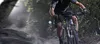 A split image showing a blurry forest scene on the left and a person riding a mountain bike on the right. Anteprima dell’immagine prodotto