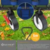 Close-up of a blue foldable wagon's wheels and handle on a grassy lawn with fallen leaves. Produktbild-Vorschau