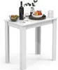 A white table with a bottle of wine, glasses, and fruit. Produktbild-Vorschau