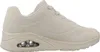 A side view of a single beige SKECHERS UNO STAND ON AIR sneaker against a white background. Voir les images du produit