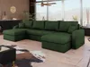 A spacious living room with a large green sectional sofa, a cowhide rug, and a black coffee table, featuring a large window with a view of mountains. Náhled obrázku produktu