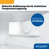 Close-up inside a white refrigerator, showing the temperature control dial and a blue circular badge with text. Produktbild-Vorschau