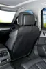 Interior of a car showing a seat protector on the back of a car seat. Produktbild-Vorschau
